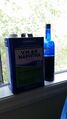 Transferred solution into a glass container and added Naptha